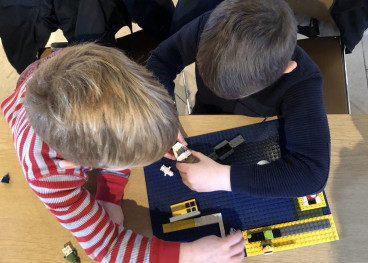 Children playing with Lego